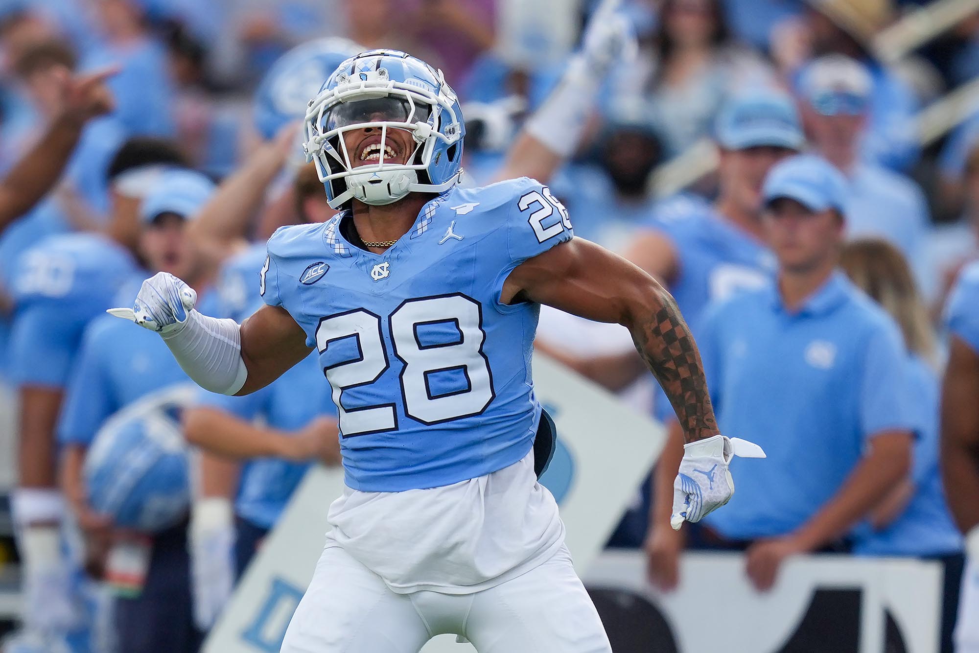 Harrell leads North Carolina past Charlotte 38-20 in new role