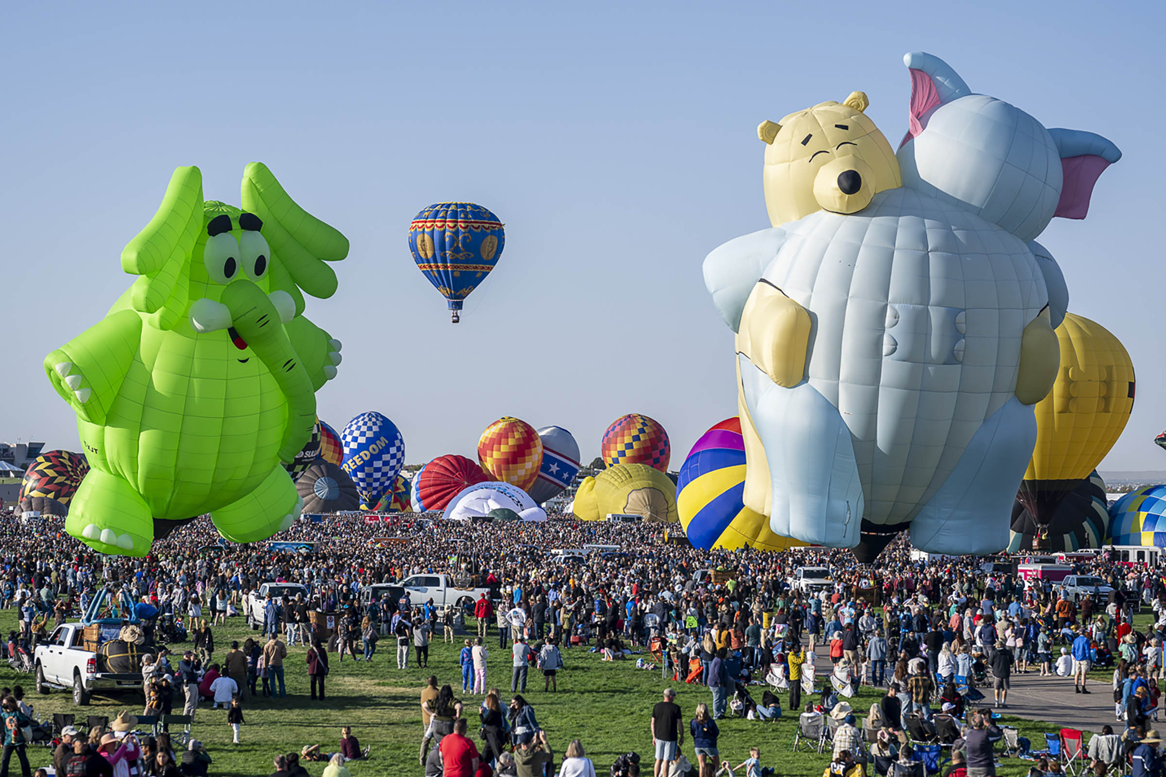 ‘Magical’ flotilla of hot air balloons take flight at international fiesta amid warm temperatures