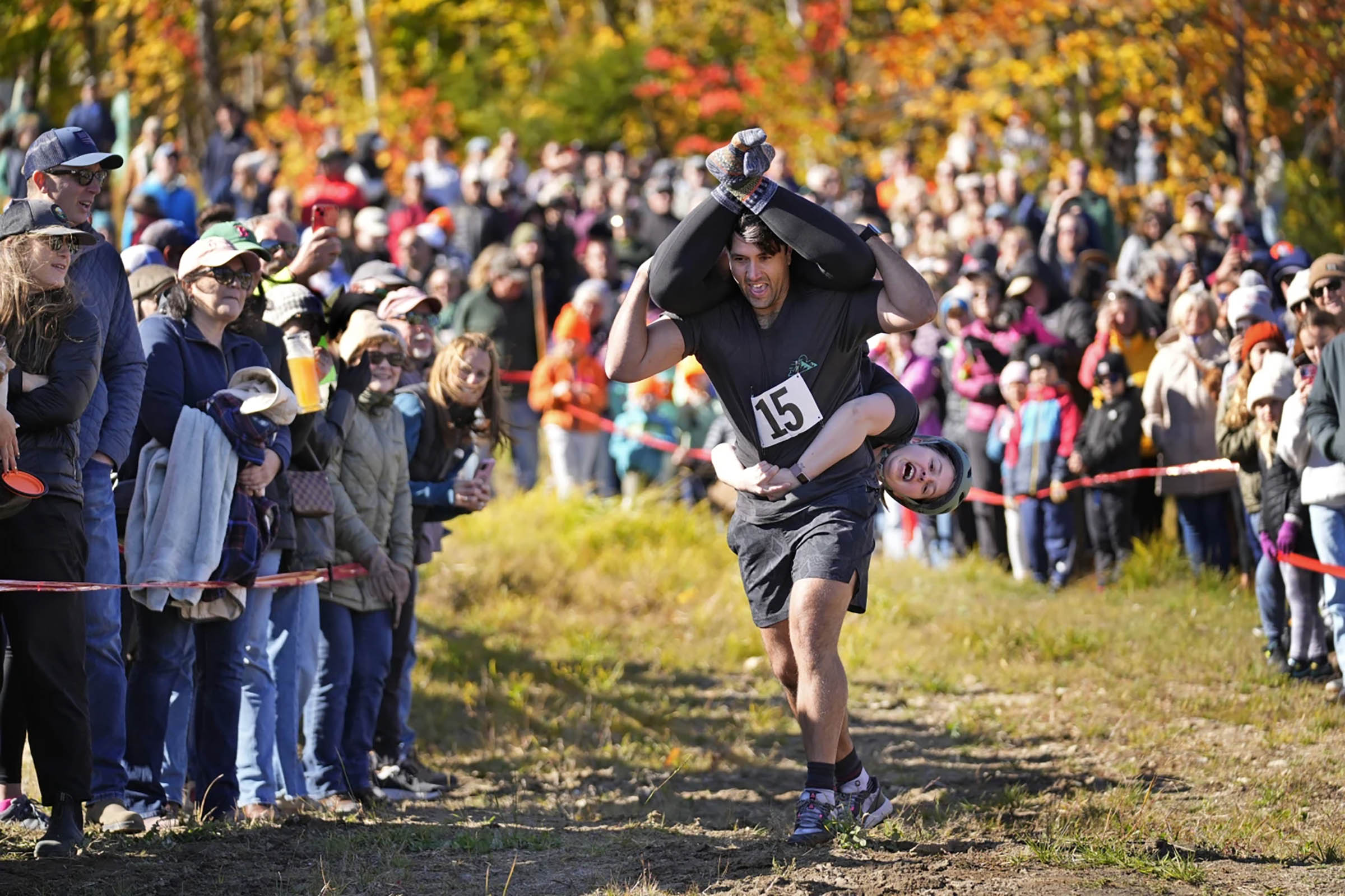 Mud, beer and cash: Annual wife-carrying championship attracts competitive couples to Maine