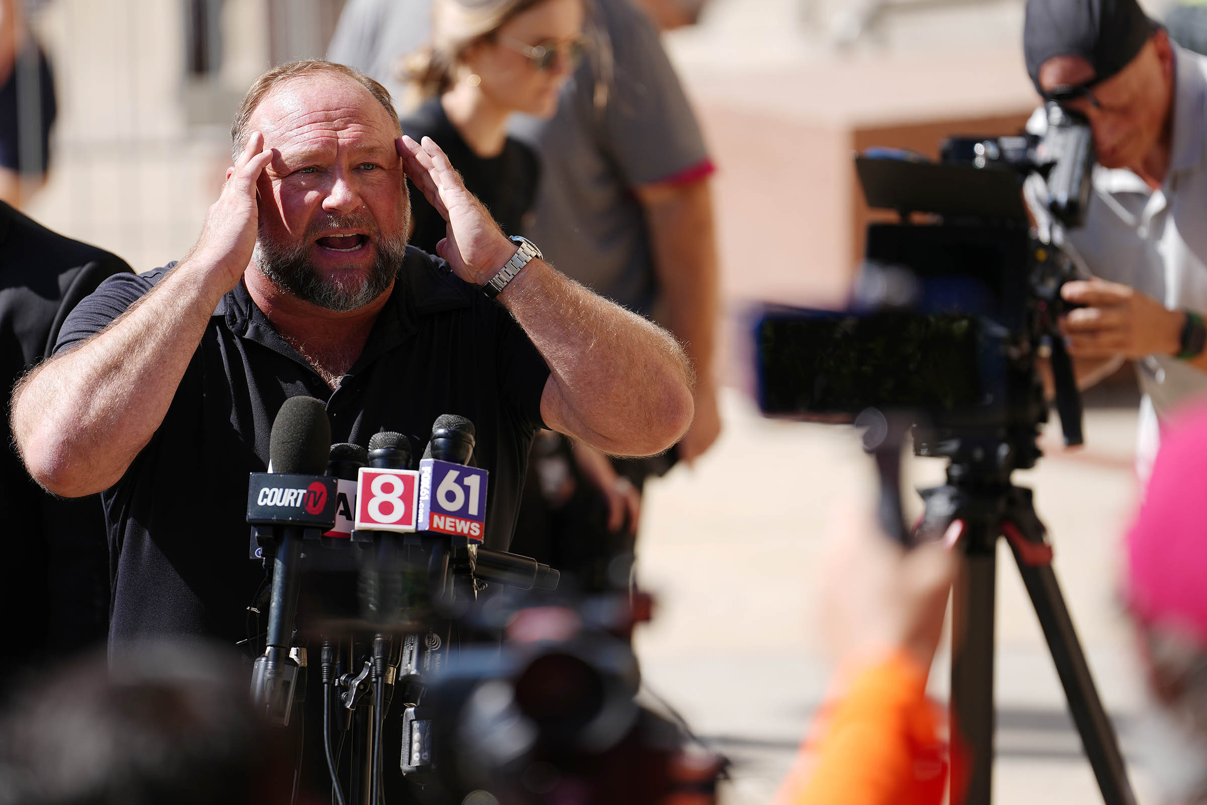 Satire publication The Onion buys Alex Jones’ Infowars at auction with Sandy Hook families’ backing